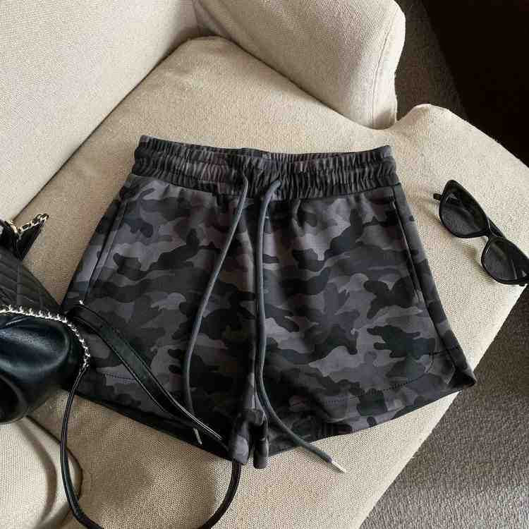 Grey camo print shorts with elastic drawstring waist and side pockets, front view