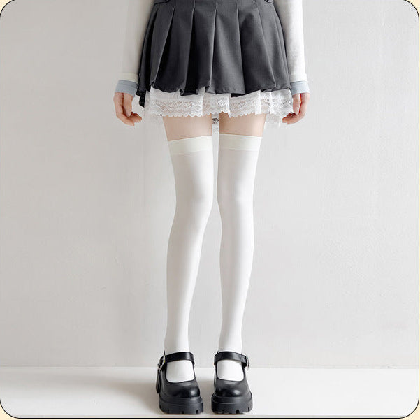 Femboy thigh high socks white velvet silicone cat paw grip band close up