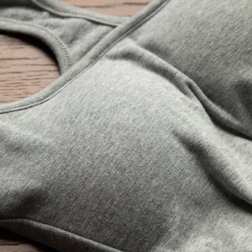 close-up detail shot, top-down — heather grey ribbed cotton showing seam and texture, cotton femboy tank