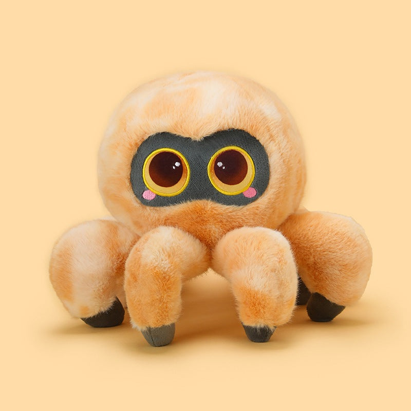 Front-facing light brown cute spider plush with fluffy fur, large expressive eyes, rounded body shape, and soft plush legs displayed against a pastel yellow studio background.