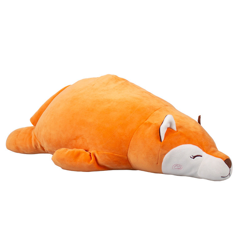 Clean studio product shot of the Femboy Fox Plushie resting horizontally, photographed from a low side angle on a white background, showcasing its rounded fox design, soft orange palette, and minimalist aesthetic, a popular plush accessory from a femboy clothing online store.