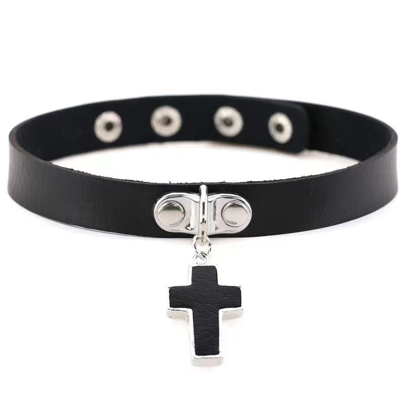 Black faux leather femboy choker with a dangling silver cross charm, adjustable snap closure, and clean gothic styling, photographed on a white background for femboy fashion accessories.