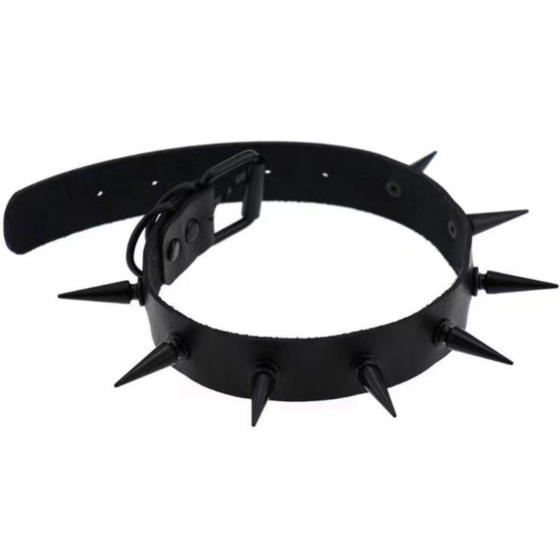 Black leather spiked gothic femboy choker with sharp cone studs, shown in angled product view on white background, styled for bold femboy fashion and alternative outfits.