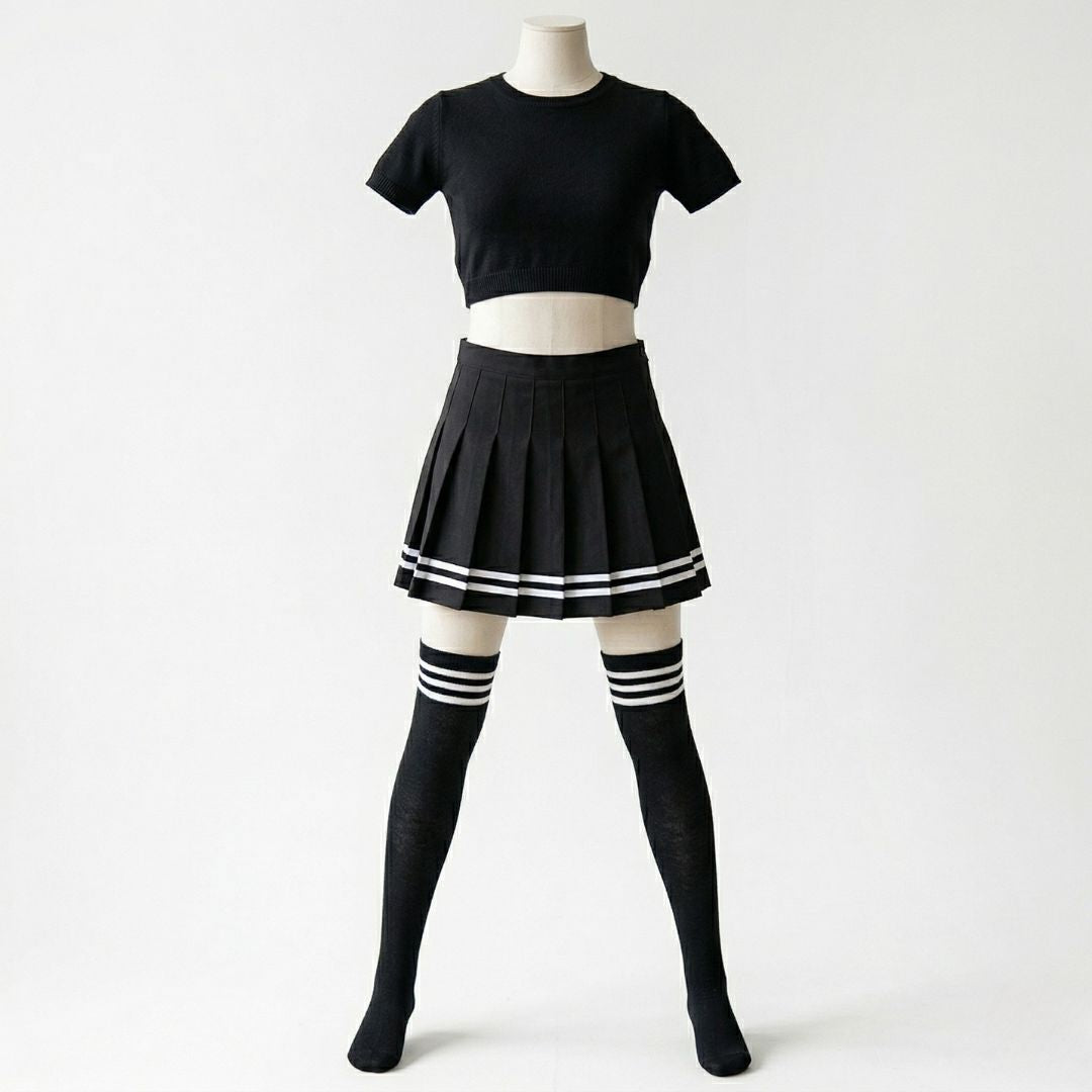 Headless mannequin wearing the Femboy Starter Pack: cropped knit top, pleated mini-skirt with stripes, and over-the-knee socks, all in black-and-white.