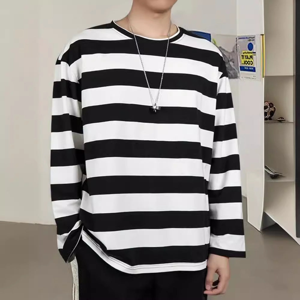 Femboy in a casual black and white striped long sleeve sweatshirt, perfect for stylish layered femboy outfits.