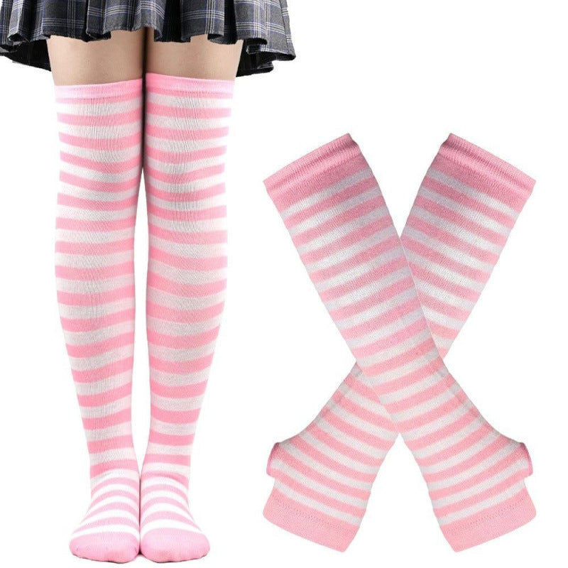 Pink and white striped thigh high socks with matching arm warmers shown on legs and hands, soft pastel femboy clothing designed for cute and feminine femboy outfits