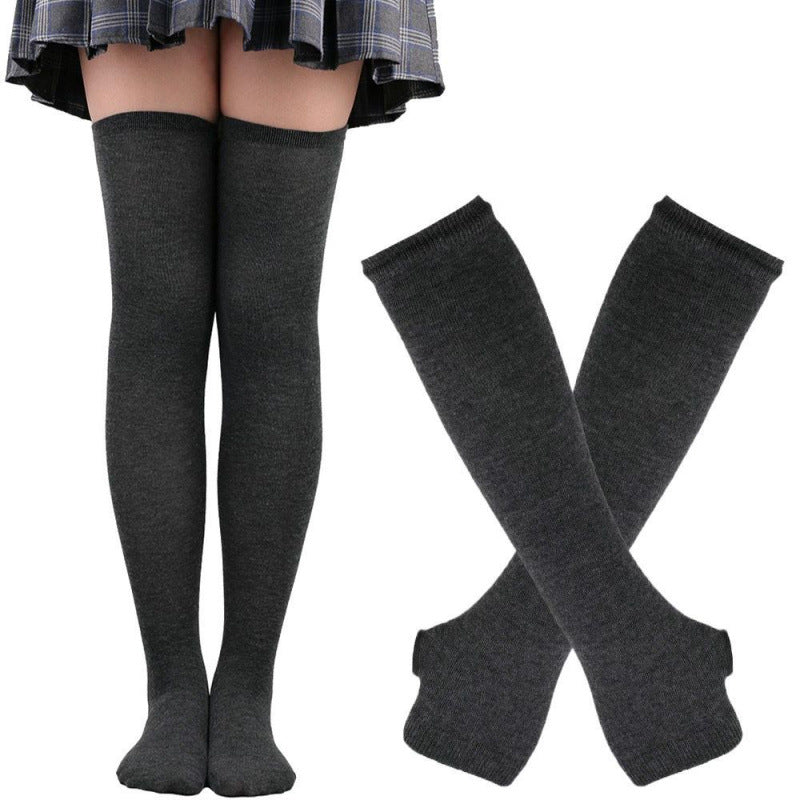 Solid dark grey thigh high socks with matching arm warmers displayed on model legs and hands, minimalist cotton femboy clothing for cozy everyday femboy fashion