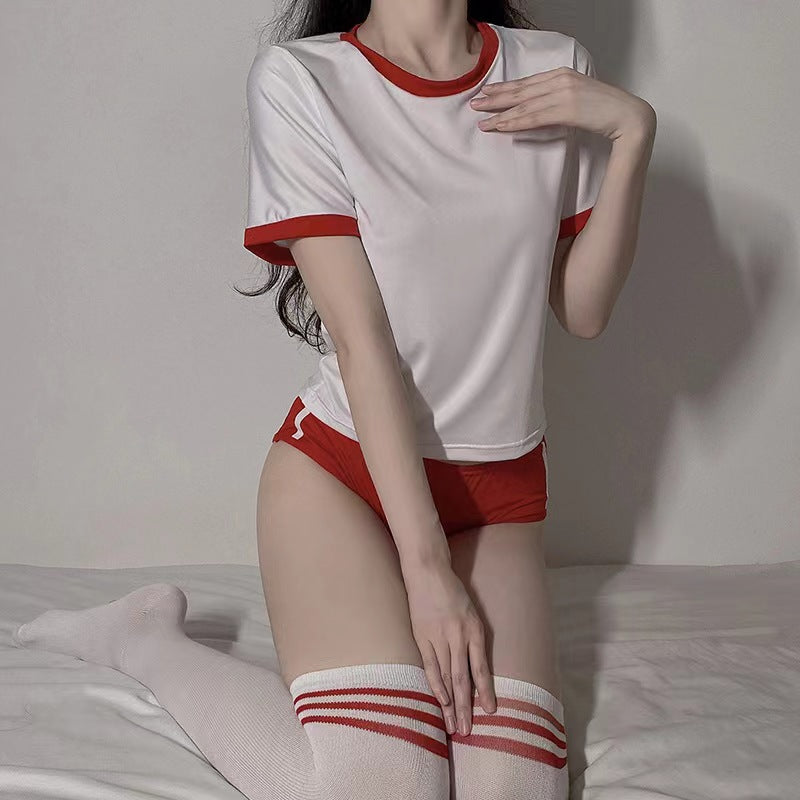 Mirror-selfie full-body shot of white Japanese Femboy Gym Kit with red trim tee and matching red shorts paired with white knee socks, femboy workout outfit.