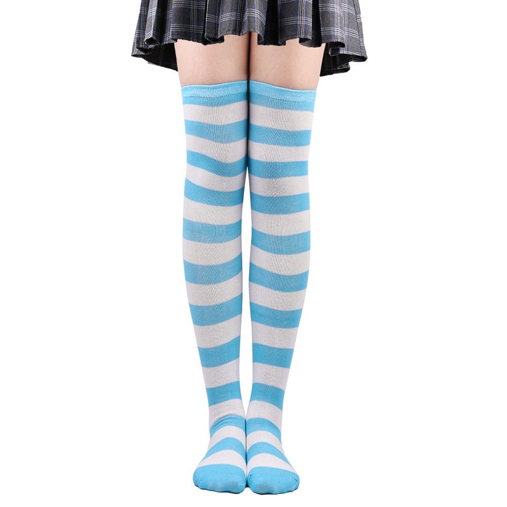 Light blue and white striped femboy thigh high socks shown from a straight-on angle, over-the-knee length with snug fit, pastel striped femboy outfit accessory.