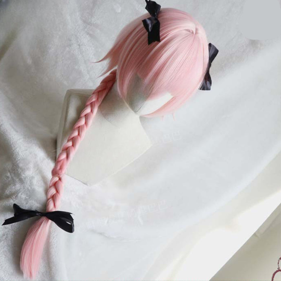 Three-quarter angle view of pastel pink Asotfol femboy wig with straight bangs, side braid, and black bow ties – stylish femboy clothing accessory for cute outfits