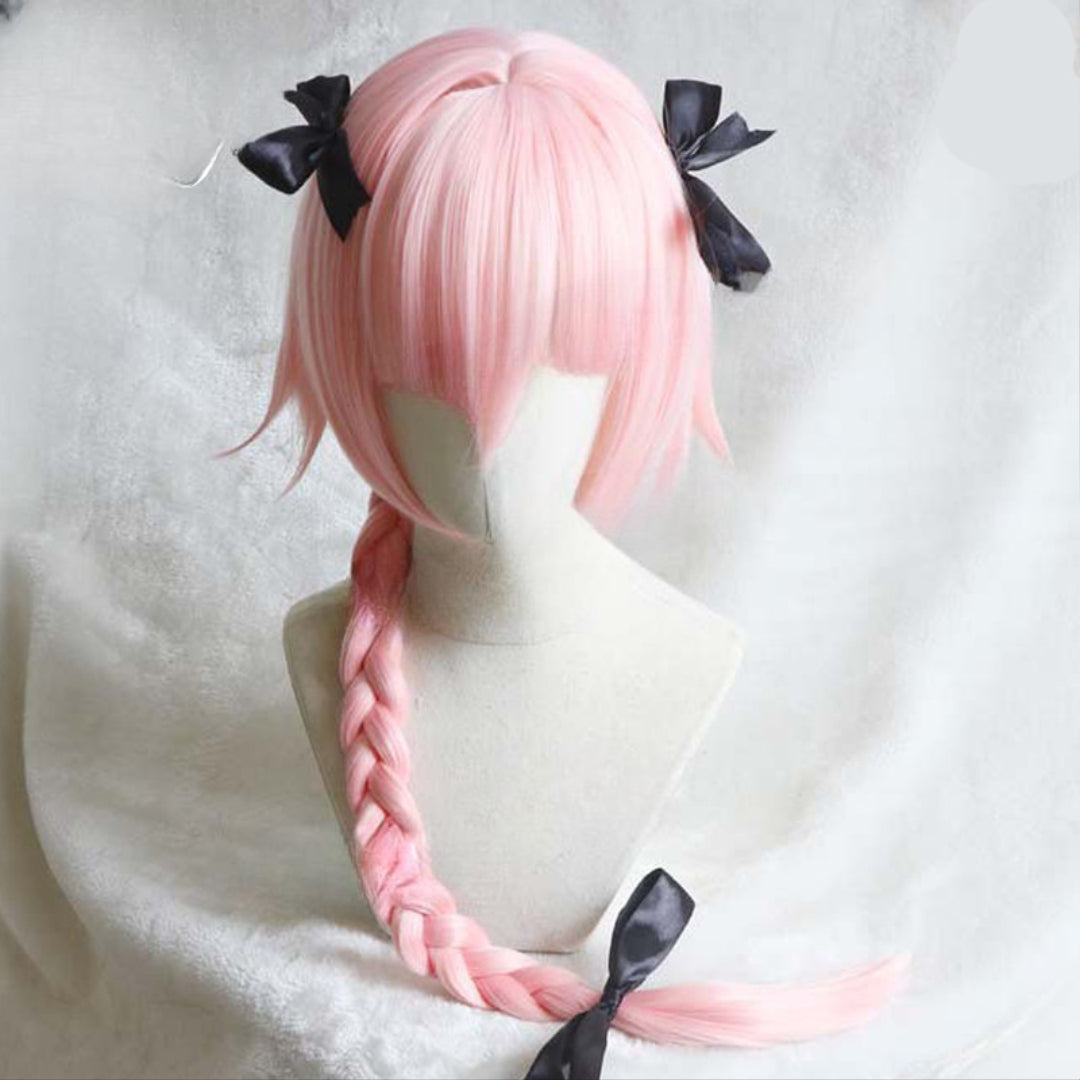 Front view studio shot of pastel pink Asotfol femboy wig styled with long side braid and black satin ribbon bows – soft kawaii femboy fashion accessory