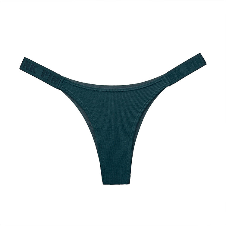 Flat-lay close-up of teal seamless femboy briefs featuring soft ribbed fabric and elastic logo straps, shot on a white studio background for clean ecommerce presentation, femboy clothes, femboy fashion.