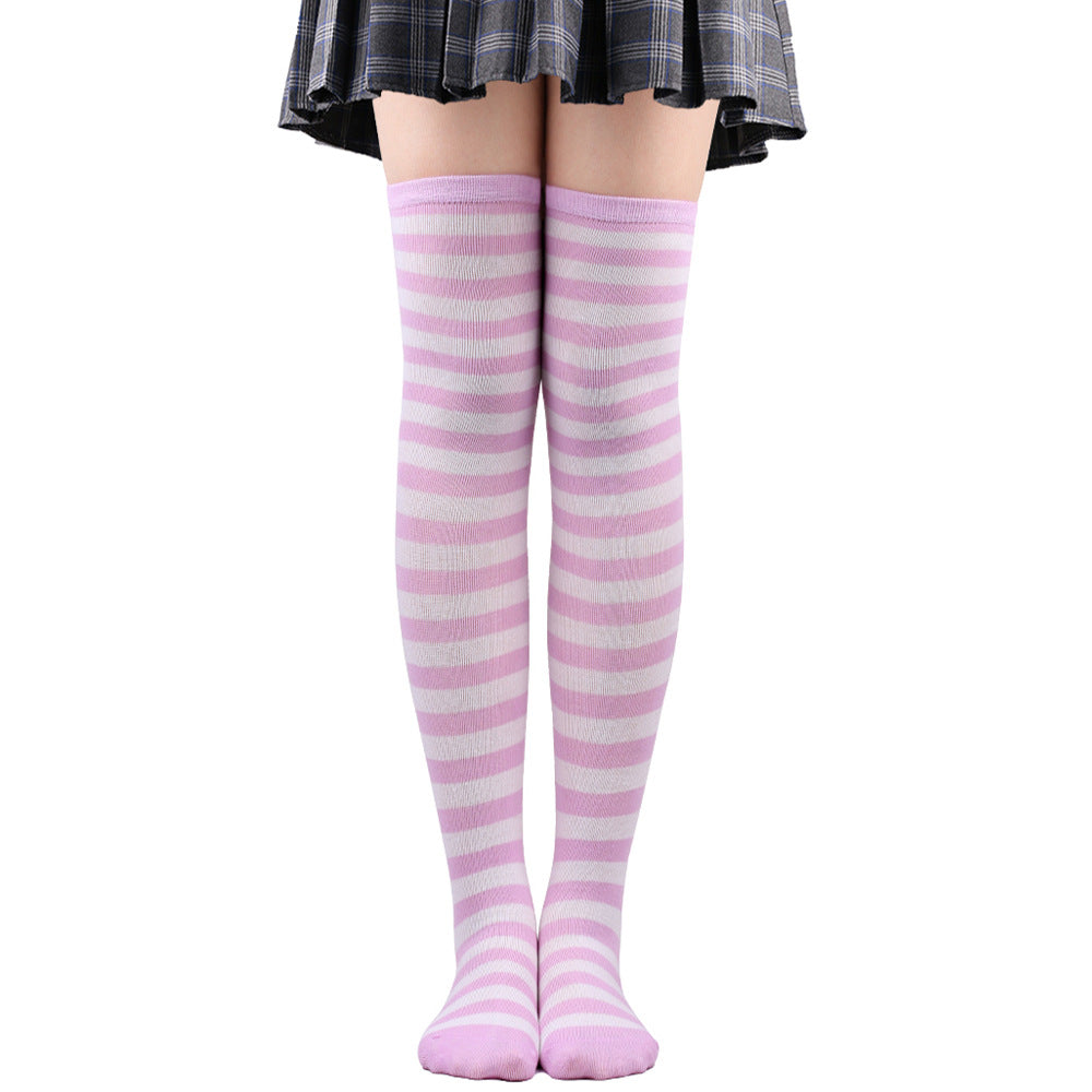 Light pink and white striped femboy thigh high socks worn on legs, front-facing full-length shot against a white background, soft pastel femboy clothing style.