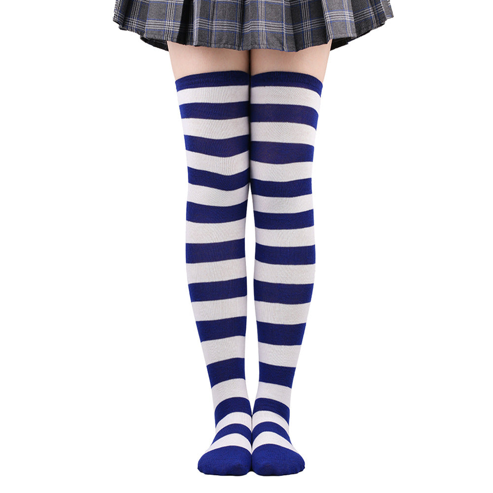 Navy blue and white striped femboy thigh high socks photographed worn in a full-length front view, classic striped femboy fashion accessory on a clean white background.