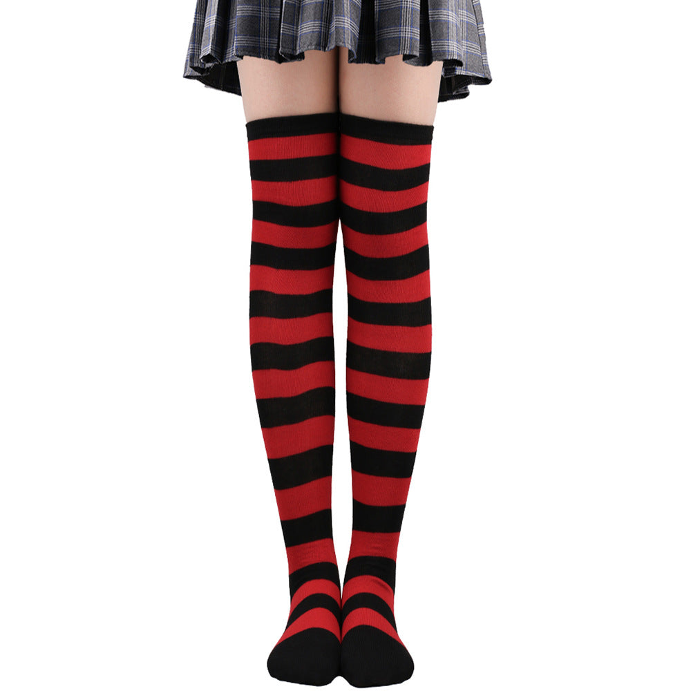 Classic red and black striped femboy thigh high socks presented in a straight-on studio shot, cotton stretch fabric designed for comfort and style, perfect for bold femboy fashion and expressive femboy clothing looks on a white background.