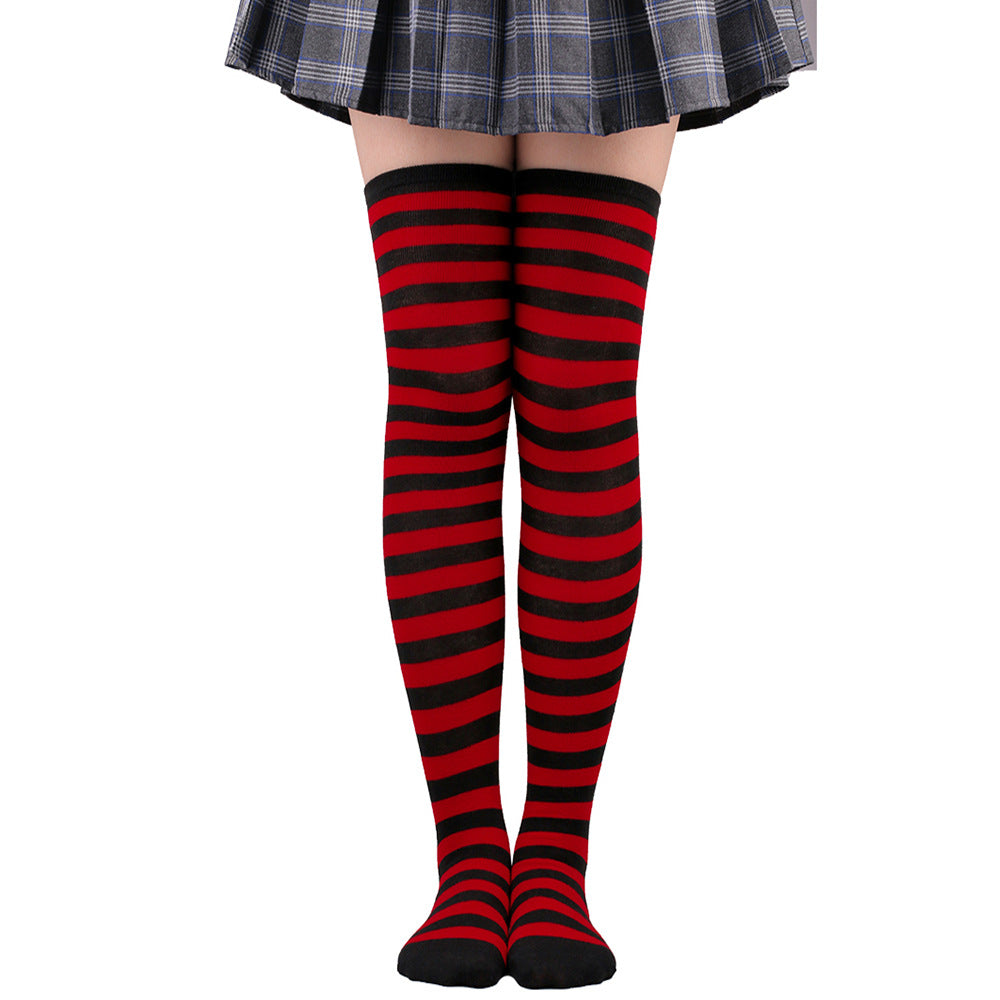 Red and black striped femboy thigh high socks shown in a front-facing studio shot, bold contrast cotton fabric with comfortable stretch, ideal for gothic or edgy femboy clothing looks, captured on a clean white background.