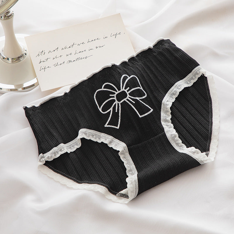 Top-down close-up of elegant black Lolita Bowknot Panties with white bow embroidery and scalloped lace trim, perfect for adding a chic touch to femboy outfits.