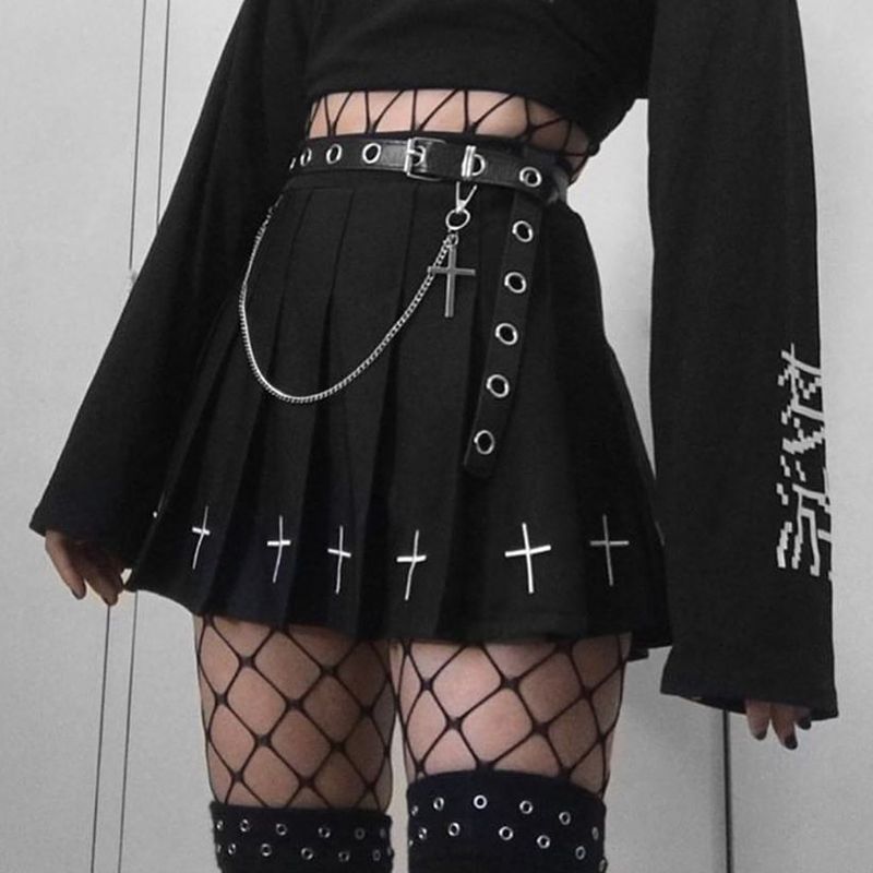 Black gothic cross pleated skirt paired with belt and chain accessories, dark aesthetic femboy outfit with fishnet stockings and oversized top