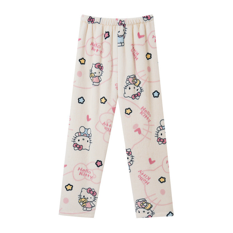 Cream-coloured Hello Kitty print fleece pants laid flat on a white background, featuring pastel hearts, stars and Hello Kitty illustrations, soft and cute femboy loungewear pants.