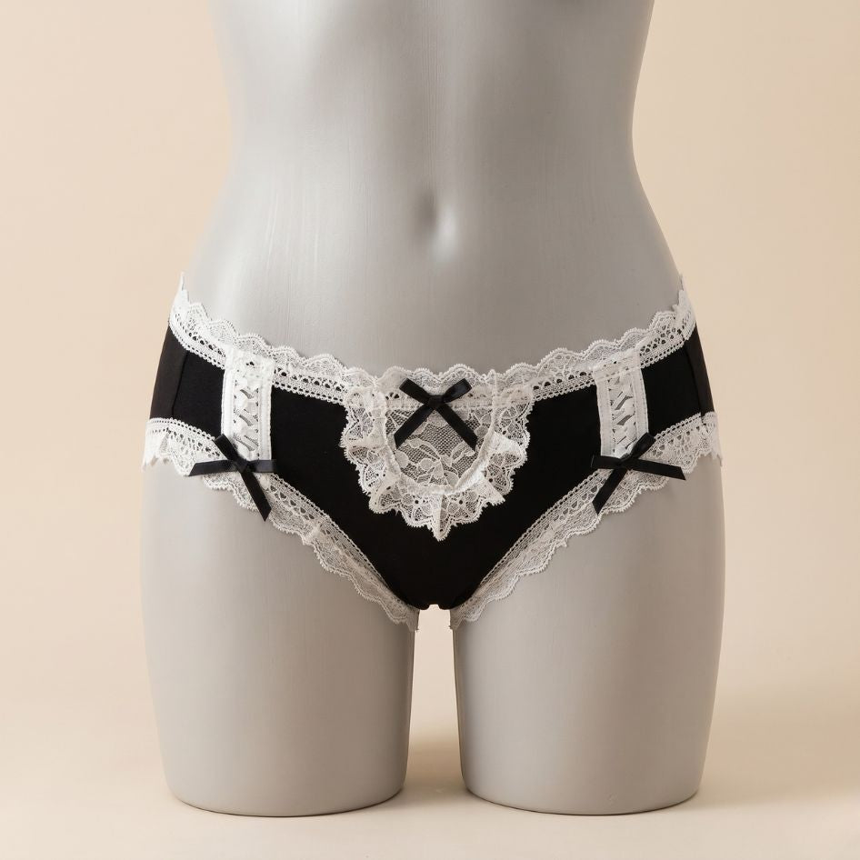 Black and white femboy maid panties with lace trim, ribbon bow detail and corset lace-up sides from FemboyBox