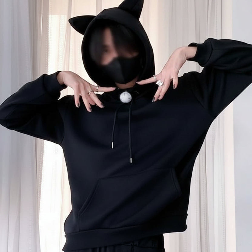 Black cat ear femboy hoodie worn lifestyle shot, cute kawaii aesthetic oversized sweatshirt from FemboyBox