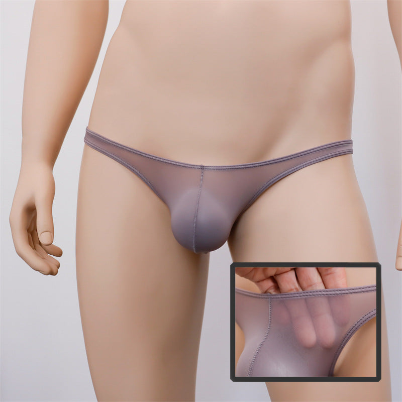 Front view of a grey see-through femboy G-string displayed on a mannequin, featuring a zoom-in on the sheer material to emphasize the delicate and sleek design. A perfect addition for femboy clothing enthusiasts looking for bold and stylish pieces.