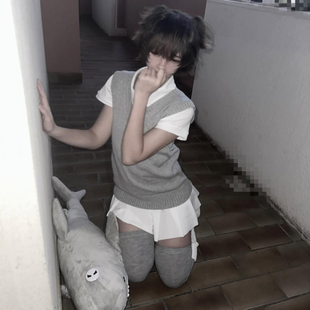 College femboy kit with grey sweater vest, white pleated mini skirt and thigh high socks, cute aesthetic mirror selfie from FemboyBox