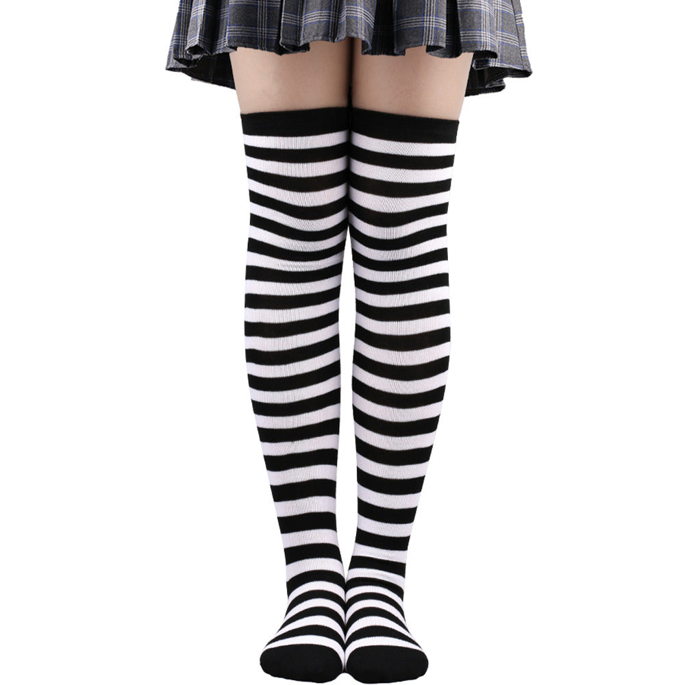 Black and white thin striped thigh high socks over the knee, classic femboy hosiery from FemboyBox
