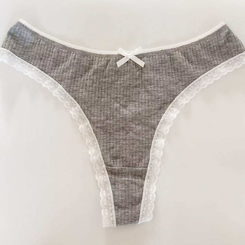 Flat-lay of a gray Bowknot Lace Trim Thong featuring ribbed fabric, delicate white lace trim, and a bowknot accent. Captured on a neutral background to highlight modern femboy clothing essentials.