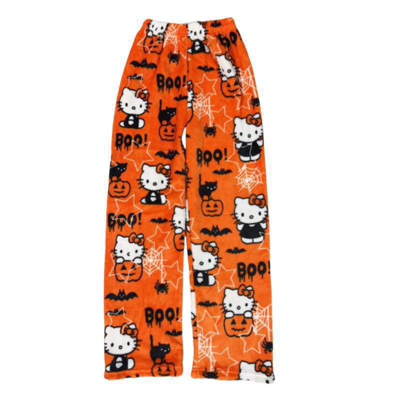 Pumpkin Hello Kitty print fleece pants laid flat on a white background, featuring Halloween-themed graphics like pumpkins, bats, spider webs and BOO text, soft lounge-style femboy pants.
