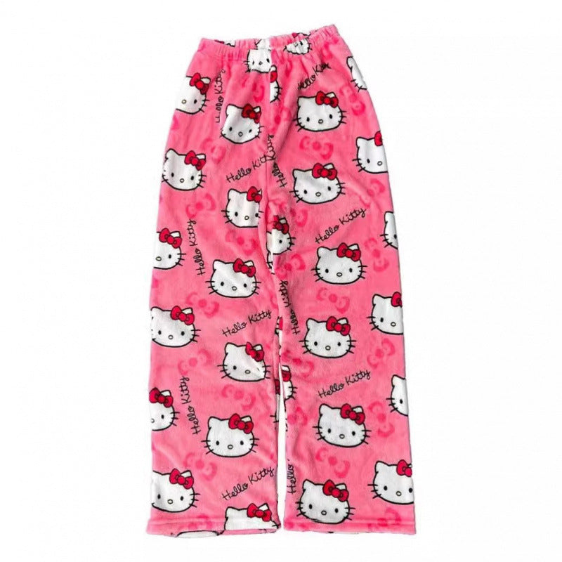 Pink Hello Kitty print femboy pants shown in a flat lay product shot, featuring an all-over Hello Kitty pattern on soft plush fabric with a relaxed straight-leg fit against a white background.