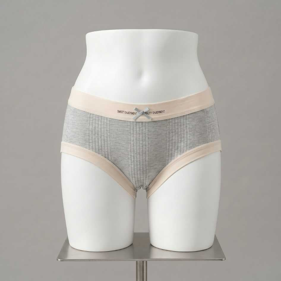 Grey ribbed modal femboy panties with cream contrast waistband and ribbon bow detail