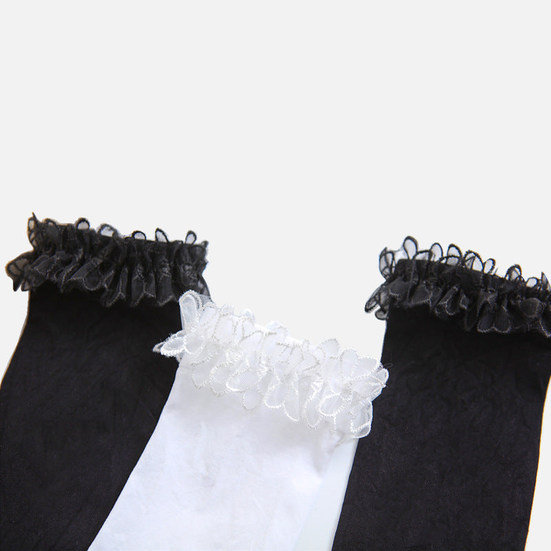 Femboy socks black white lace ruffle cuff velvet lolita pair flat lay