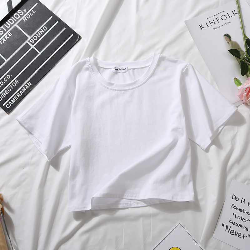 A white Loose Crop Top Tee displayed in a flat lay arrangement. The simple design is versatile for various femboy fashion styles, suitable for layering or wearing on its own.