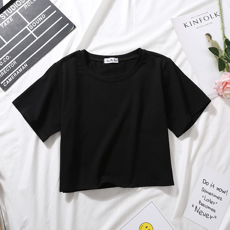 A black Loose Crop Top Tee laid flat on a white surface. This essential piece fits seamlessly into any femboy clothing collection, offering endless styling possibilities.