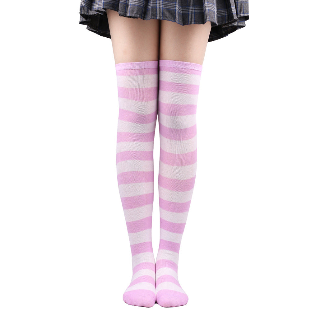 Soft pastel pink and white striped femboy thigh highs shown on legs, straight-on view with clean white background, cozy femboy fashion aesthetic.