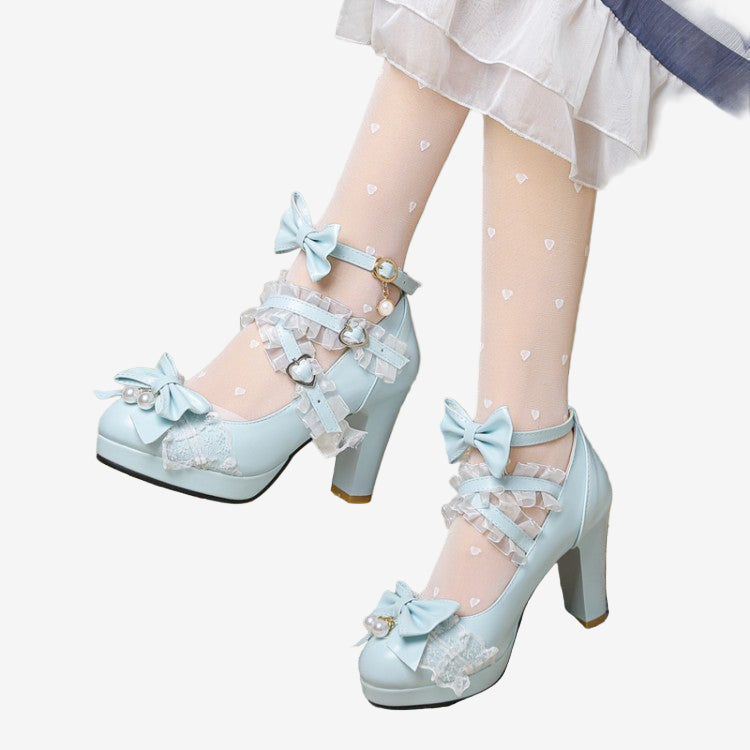 Model in sky blue Lolita Bowlace pumps adorned with bows and lace, paired with heart-patterned tights, capturing a playful yet elegant style perfect for femboy fashion connoisseurs.