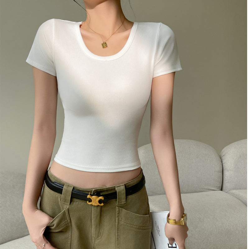 A minimalist front view of a model in a white slim fit cotton tee, styled with olive green pants, perfect for enhancing casual femboy outfits in femboy fashion.